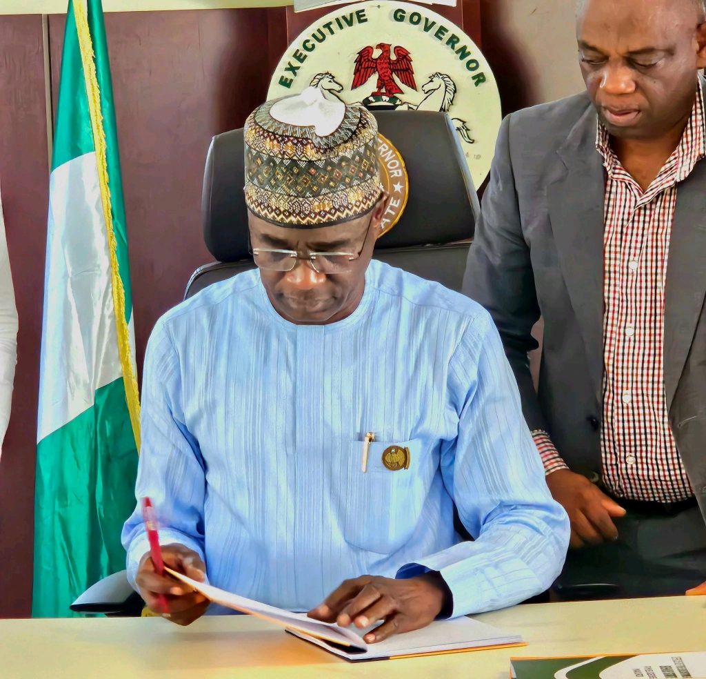 Alia Signs a bill in to Law