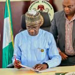 Alia Signs a bill in to Law