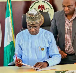 Alia Signs a bill in to Law