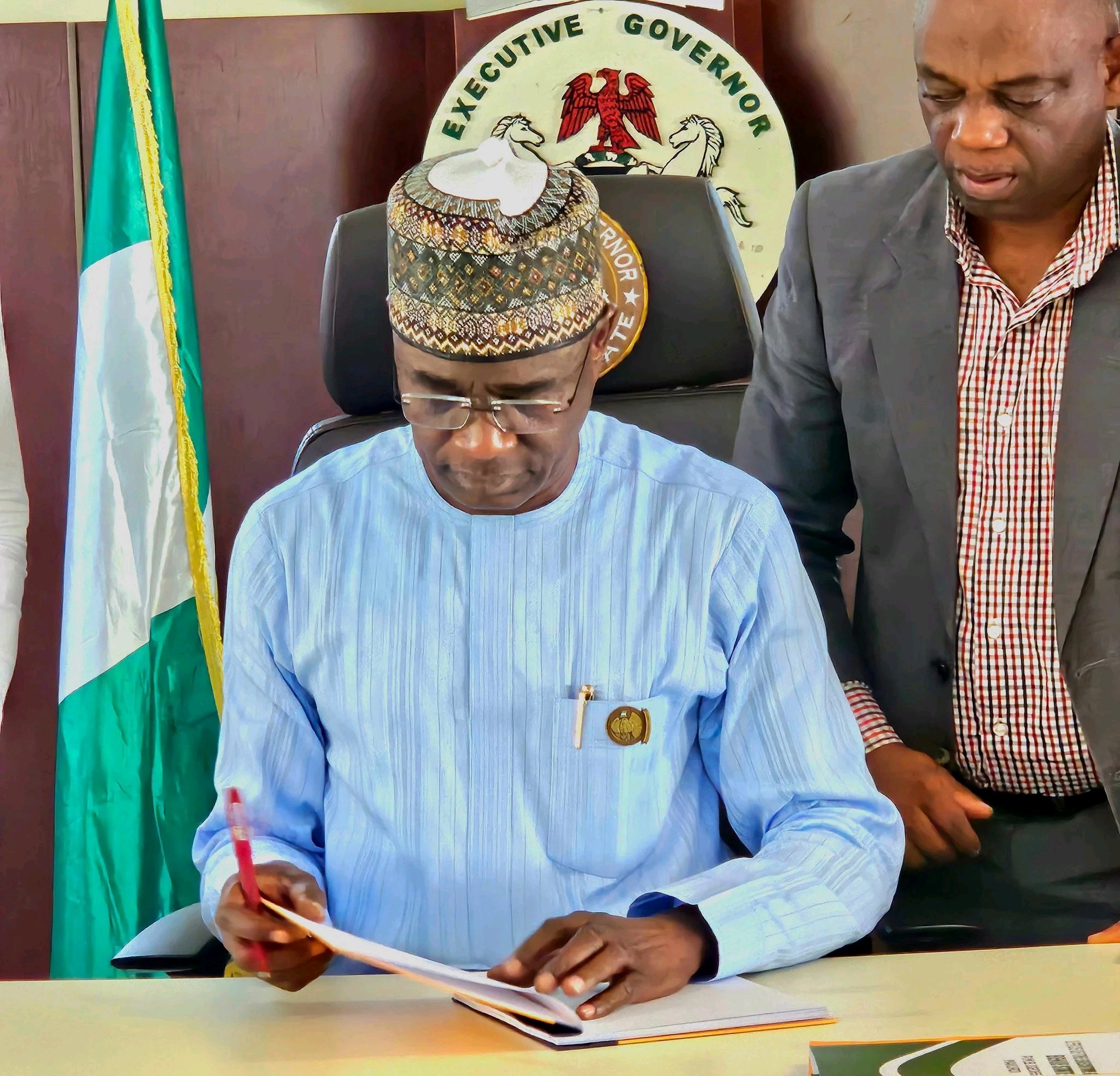 Alia Signs a bill in to Law